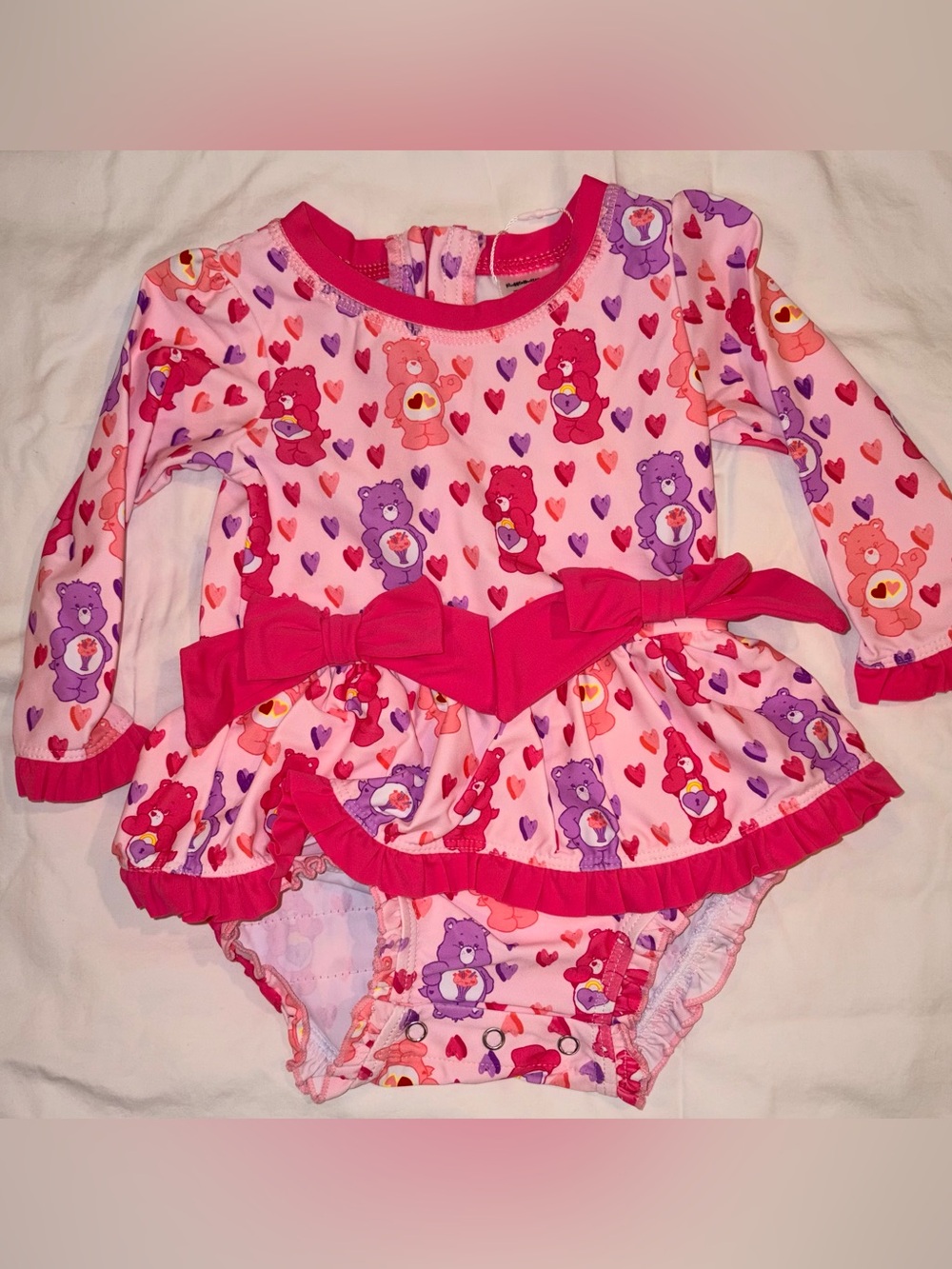 Ruffle Butts X Care Bears long sleeve 1 piece swimsuit/rashguard sz 12-18 mo NWT